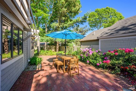 Mashpee Cape Cod vacation rental - Outdoor dining table perfect for meals and gathering outside.
