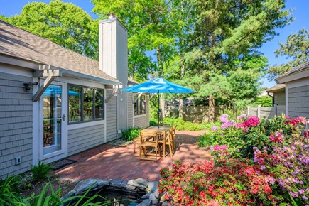 Mashpee Cape Cod vacation rental - Outdoor dining table perfect for meals and gathering outside.