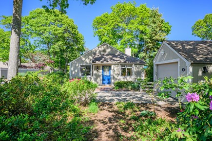 Mashpee Cape Cod vacation rental - Beautiful flowers in the front yard create a warm and inviting entrance.