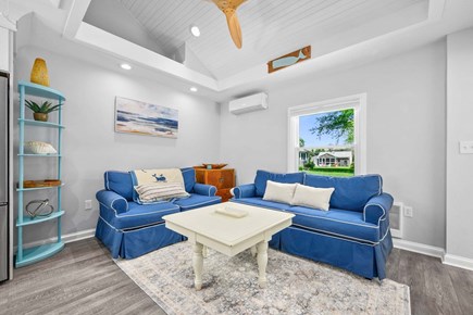 Brewster Cape Cod vacation rental - Comfortable seating in the living room provides a cozy and inviting space to relax, unwind, and spend time with family and friends.