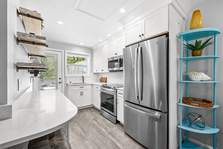 Brewster Cape Cod vacation rental - Fully equipped kitchen featuring modern appliances and all the essentials needed for preparing meals and enjoying home-cooked dining during your stay.