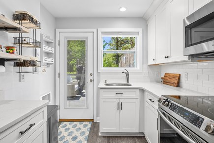 Brewster Cape Cod vacation rental - Kitchen has direct access to the back deck, creating an easy flow between indoor and outdoor living spaces.