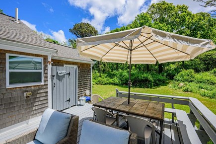 Brewster Cape Cod vacation rental - Deck featuring seating, a dining table, and an outdoor shower
