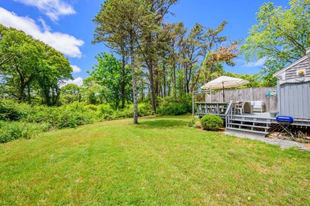 Brewster Cape Cod vacation rental - Deck in the backyard, providing a comfortable outdoor space for relaxing