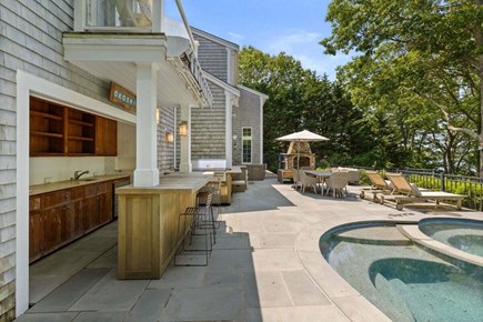 Cotuit Cape Cod vacation rental - Great outdoor Kitchen, pool and fireplace.
