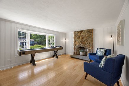 Dennis Cape Cod vacation rental - Sitting area with shuffleboard table and TV