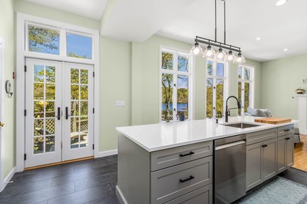 Cataumet Cape Cod vacation rental - Kitchen overlooking the pond.  Deck is out the doors.