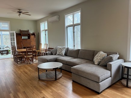 Cataumet Cape Cod vacation rental - Living area, dining area and entrance to solarium