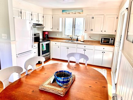 Truro Cape Cod vacation rental - Dining table + kitchen