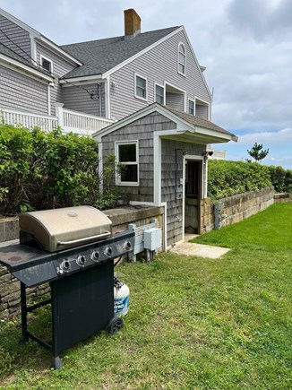Dennisport Cape Cod vacation rental - Gas grill and outside shower area on our lawn