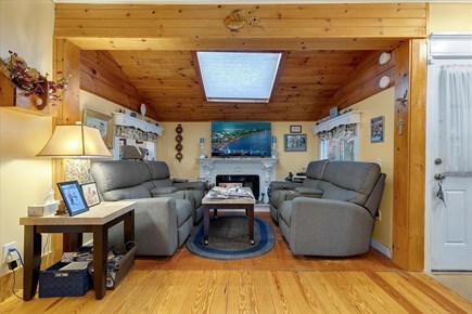 Dennisport Cape Cod vacation rental - First floor living room w/skylight and fireplace