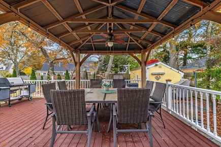 Dennisport Cape Cod vacation rental - Back deck with Pergola, lights and fan