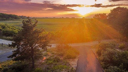 Eastham Cape Cod vacation rental - View from front porch towards the ocean at sunset