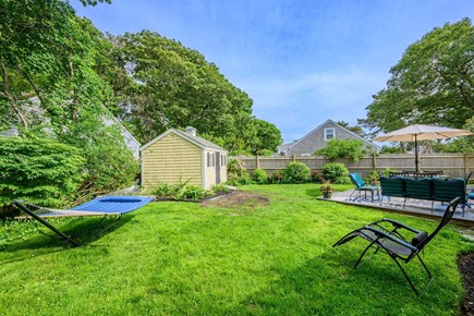 Hyannis Cape Cod vacation rental - Backyard featuring a hammock, offering a relaxing spot to unwind and enjoy the outdoor surroundings.