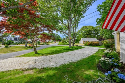 Hyannis Cape Cod vacation rental - Landscaped exterior with convenient parking, showcasing the home’s outdoor setting and easy access for guests.