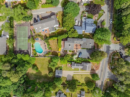 Centerville Cape Cod vacation rental - Aerial view of the shared pool and tennis court, showcasing the community amenities and landscaped surroundings