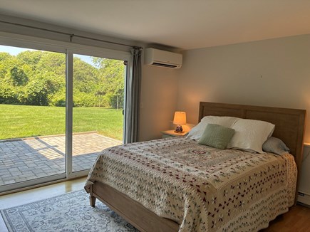 Dennis Cape Cod vacation rental - Bedroom 2 with queen bed and sliders to patio and yard
