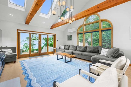 Plymouth MA vacation rental - Bright living room featuring a large window that fills the space with natural light