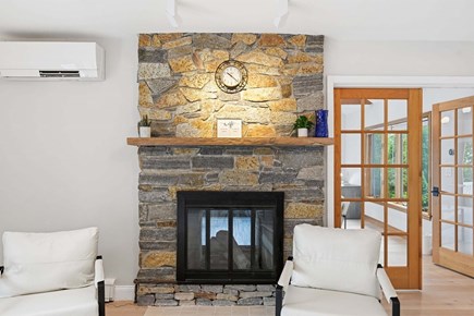 Plymouth MA vacation rental - Elegant electric fireplace shared between the living and family rooms