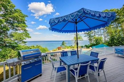 Plymouth MA vacation rental - Spacious oceanview deck featuring an outdoor dining table and gas grill, perfect for al fresco meals