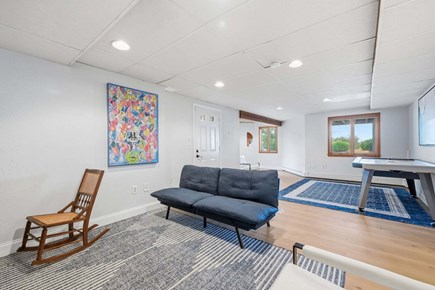 Plymouth MA vacation rental - Lower-level living room offering a private and comfortable retreat with relaxed seating and a fun air  hockey table