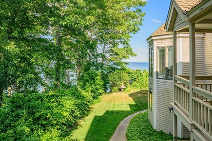 Plymouth MA vacation rental - View of the side yard showcasing a peaceful outdoor space