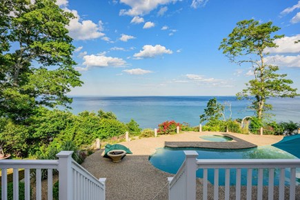 Plymouth MA vacation rental - View from the deck overlooking the backyard, featuring the hot tub and heated pool