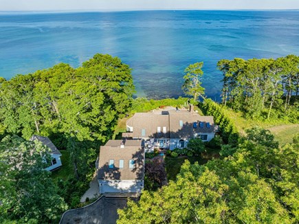 Plymouth MA vacation rental - Aerial view of the backyard and ocean showcasing the property’s stunning