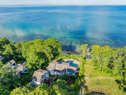 Plymouth MA vacation rental - Aerial view of the backyard and ocean showcasing the property’s stunning view
