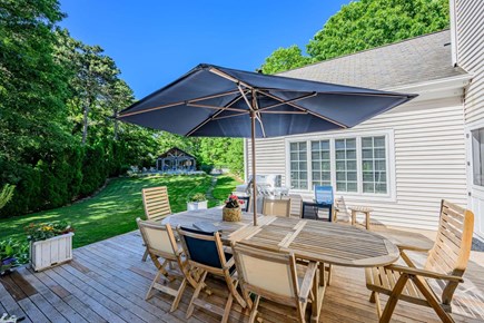 Yarmouth Port Cape Cod vacation rental - Deck with outdoor dining and views of the pool