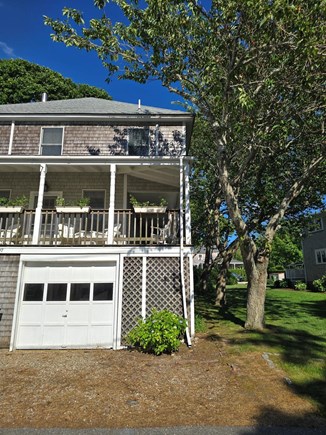 North Falmouth Cape Cod vacation rental - Front of house, wraparound porch with seating