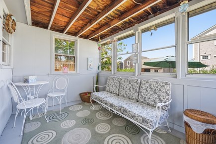 Sandwich Cape Cod vacation rental - Enjoy morning coffee or evening conversations on the furnished porch.