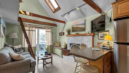 East Sandwich Cape Cod vacation rental - Kitchen/living room with seating for four guests at the island.