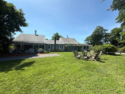Dennisport Cape Cod vacation rental - Back yard, fire pit and wood while it lasts.