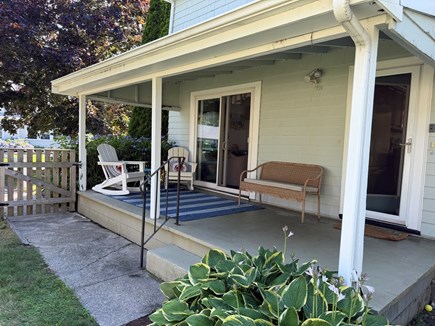 Falmouth Cape Cod vacation rental - Covered porch with fenced in side yard.