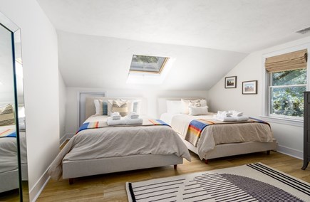 East Falmouth Cape Cod vacation rental - Back bedroom with skylight and two queen beds