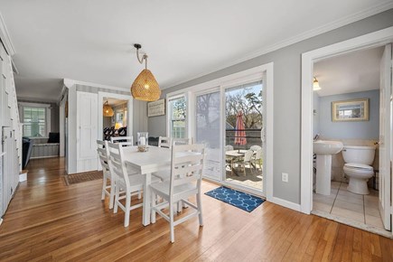 Dennis Port Cape Cod vacation rental - Open floor plan dining area, with access to half bath and yard