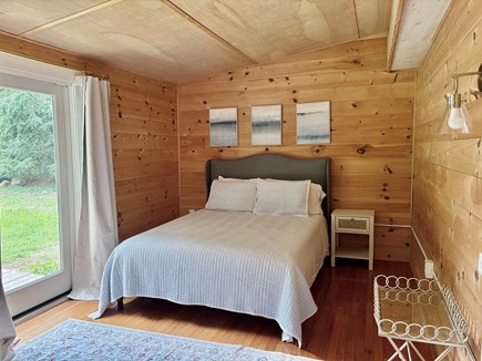 Falmouth Cape Cod vacation rental - Large master with queen bed and slider to backyard.