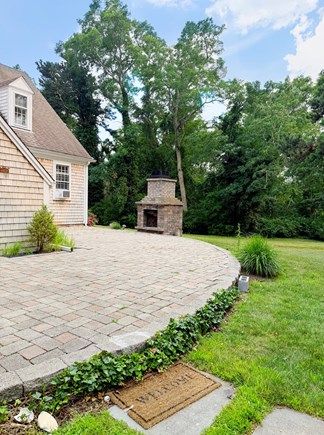 Orleans Cape Cod vacation rental - Large yard with back stone patio and fireplace