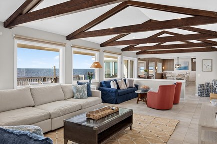 Harwichport Cape Cod vacation rental - Living room with vaulted wood-beam ceilings and cozy seating