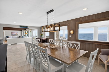 Harwichport Cape Cod vacation rental - Elegant dining space with pendant lighting and water views