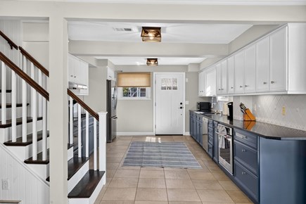Harwichport Cape Cod vacation rental - Fully equipped kitchen with navy cabinetry<br/>