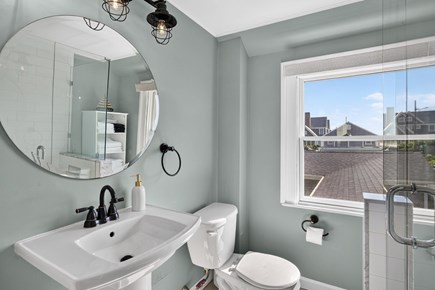 Harwichport Cape Cod vacation rental - Bright bathroom with glass shower and vanity<br/>