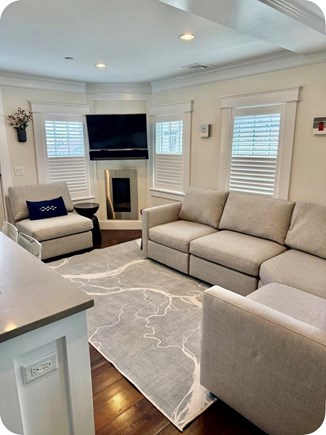 Provincetown Cape Cod vacation rental - Open-concept living area with kitchen and deck just outside