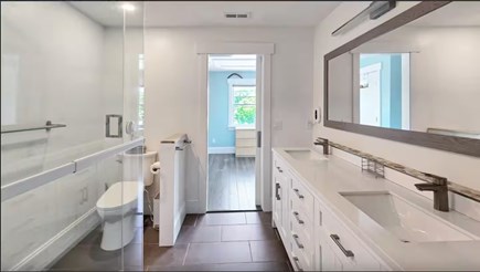 Wellfleet Village Cape Cod vacation rental - Jack-and-Jill bathroom with shower, toilet, and double vanity