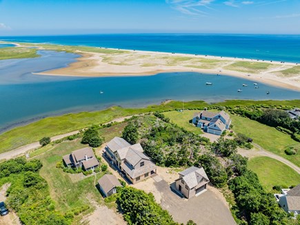Orleans, Nauset Tide Cape Cod vacation rental - Aerial waterfront view of the home, marsh, inlet and sandy coast