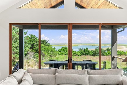 Orleans, Nauset Tide Cape Cod vacation rental - Bright living room framed by expansive sliders and coastal views.