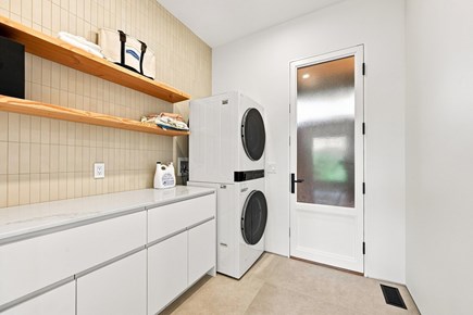Orleans, Nauset Tide Cape Cod vacation rental - Laundry room with cabinetry and shelves