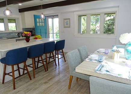 Plymouth MA vacation rental - Sunny dining area adjacent to kitchen center island with seating