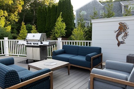 Falmouth Cape Cod vacation rental - Sitting area on the deck overlooking the backyard